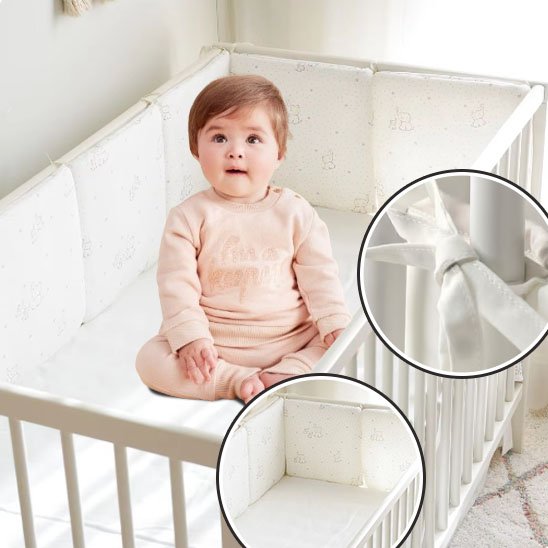 Ensemble complet pour lit bébé incluant tour de lit et matelas assorti, parfait pour une chambre harmonieuse et sécurisée.