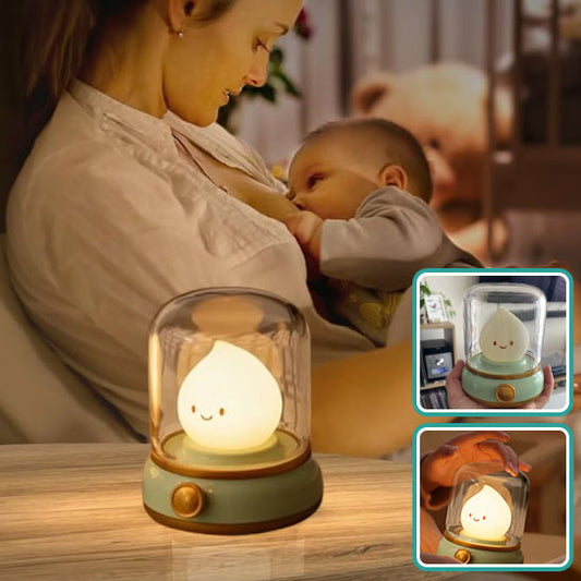 veilleuse bébé bougie maman berce bébé avec